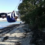 boy on tyre swing