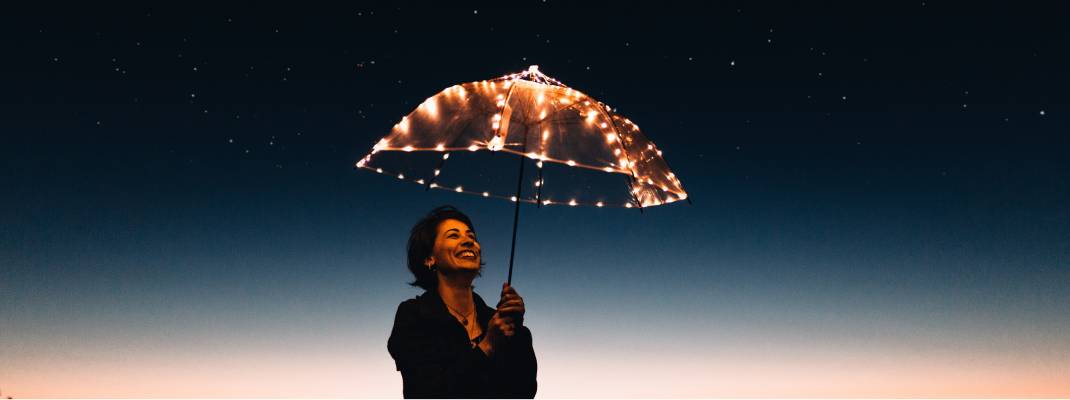 woman holding light up umbrella